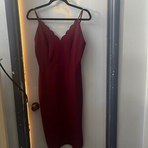 Burgundy socialite dress, mid calf length with 10 inch slit on left side.
